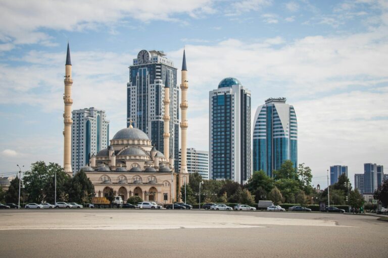 Are Islam and the West compatible? Mosque with modern skyscrapers in the background